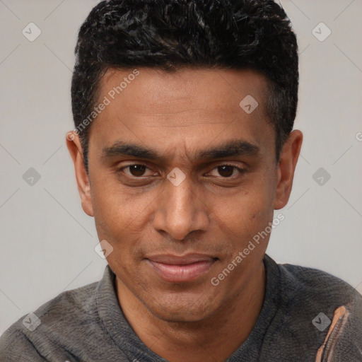 Joyful latino young-adult male with short  brown hair and brown eyes