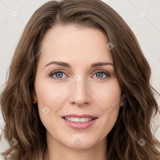 Joyful white young-adult female with long  brown hair and green eyes