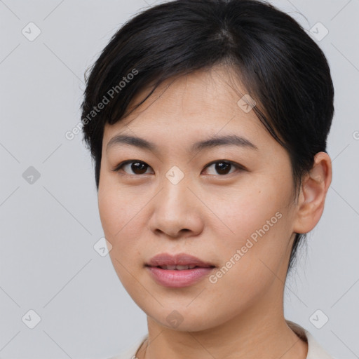 Joyful asian young-adult female with medium  brown hair and brown eyes