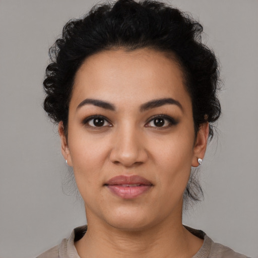Joyful latino young-adult female with medium  black hair and brown eyes