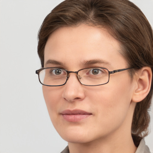 Joyful white young-adult female with medium  brown hair and grey eyes