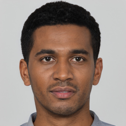 Neutral black young-adult male with short  black hair and brown eyes