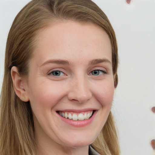 Joyful white young-adult female with long  brown hair and blue eyes