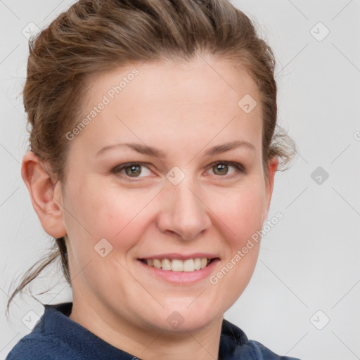 Joyful white young-adult female with short  brown hair and blue eyes