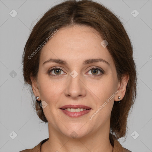 Joyful white adult female with medium  brown hair and grey eyes