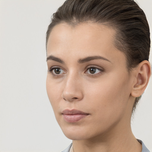 Neutral white young-adult female with short  brown hair and brown eyes