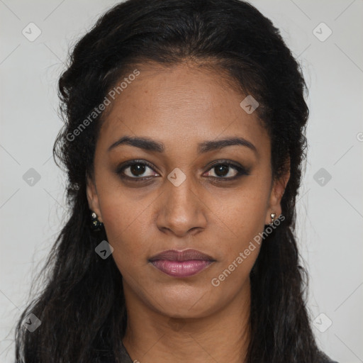 Joyful black young-adult female with long  brown hair and brown eyes