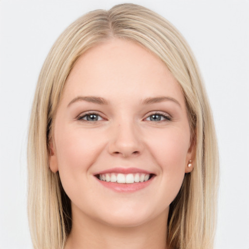 Joyful white young-adult female with long  brown hair and blue eyes