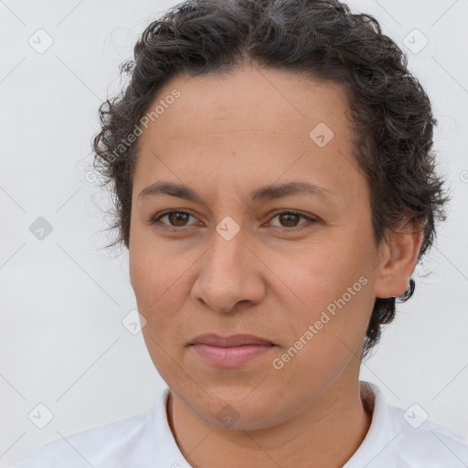 Joyful white adult female with short  brown hair and brown eyes