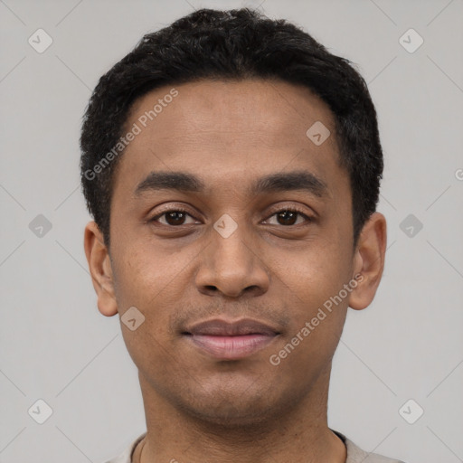 Joyful latino young-adult male with short  black hair and brown eyes