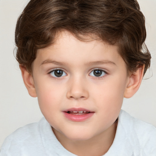 Joyful white child male with short  brown hair and brown eyes