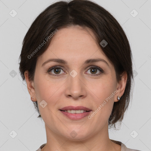 Joyful white adult female with medium  brown hair and grey eyes