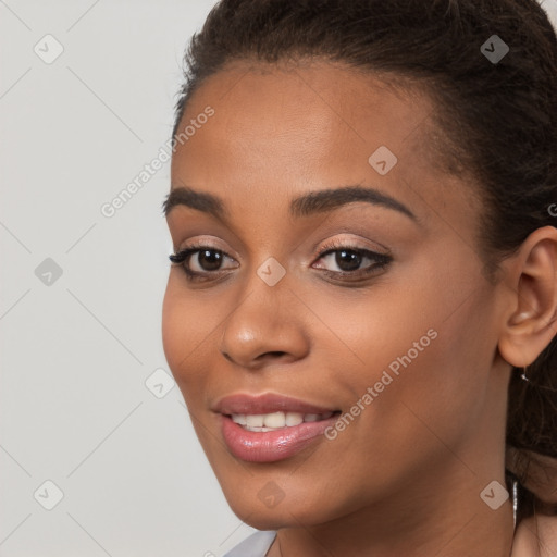 Joyful latino young-adult female with long  brown hair and brown eyes