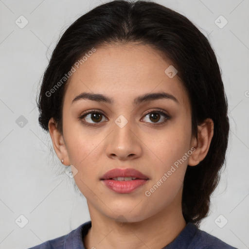 Joyful latino young-adult female with medium  brown hair and brown eyes