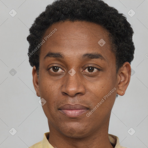 Joyful black adult male with short  black hair and brown eyes