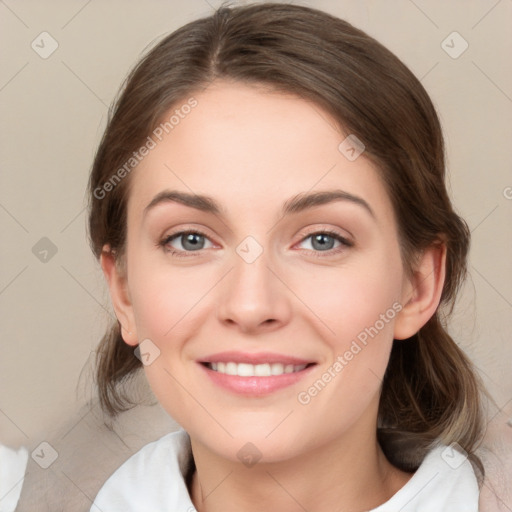 Joyful white young-adult female with medium  brown hair and green eyes