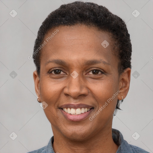 Joyful latino adult female with short  brown hair and brown eyes