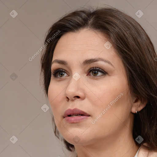 Joyful white adult female with medium  brown hair and brown eyes