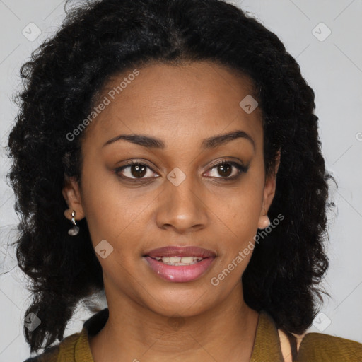 Joyful black young-adult female with long  brown hair and brown eyes