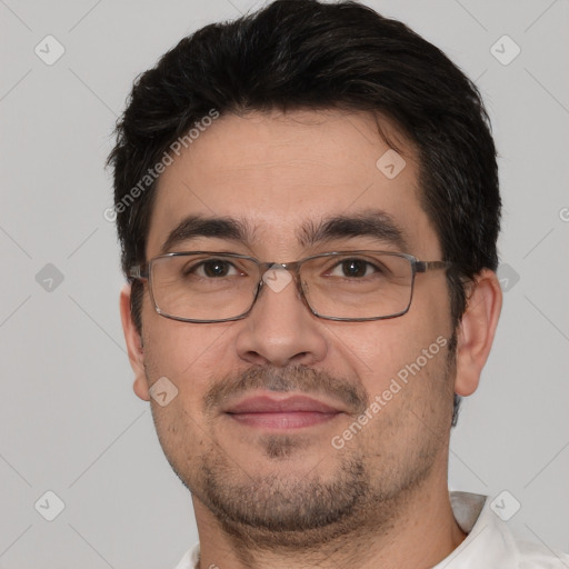 Joyful white adult male with short  black hair and brown eyes