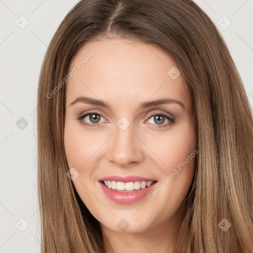 Joyful white young-adult female with long  brown hair and green eyes