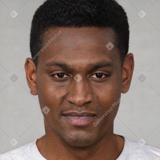 Joyful black young-adult male with short  brown hair and brown eyes