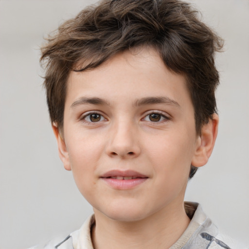 Joyful white child male with short  brown hair and brown eyes