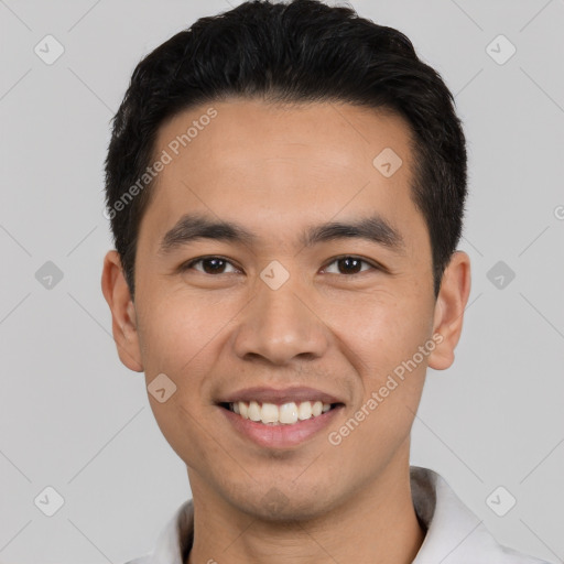 Joyful white young-adult male with short  black hair and brown eyes