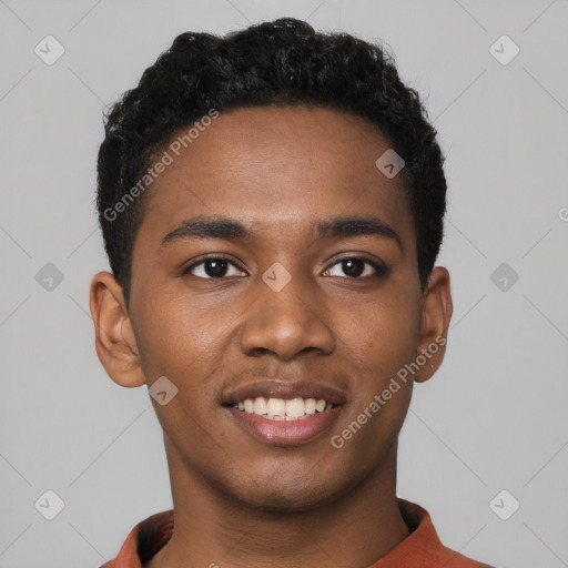 Joyful black young-adult male with short  black hair and brown eyes