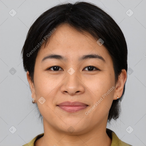 Joyful asian young-adult female with medium  brown hair and brown eyes