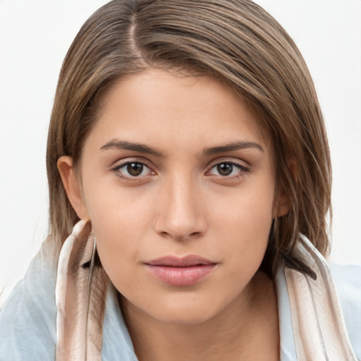 Neutral white young-adult female with long  brown hair and brown eyes