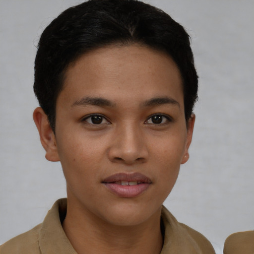 Joyful latino young-adult female with short  brown hair and brown eyes