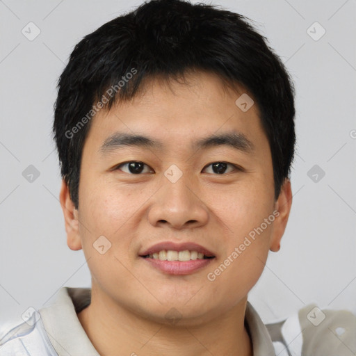 Joyful asian young-adult male with short  black hair and brown eyes