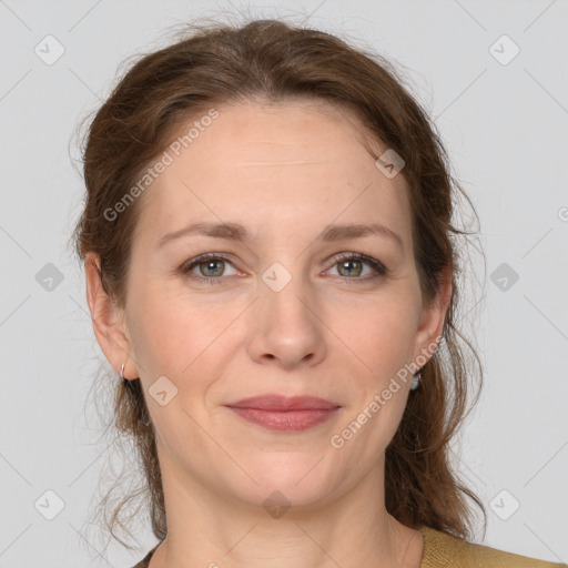 Joyful white adult female with medium  brown hair and grey eyes