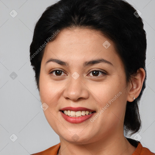 Joyful latino young-adult female with medium  brown hair and brown eyes