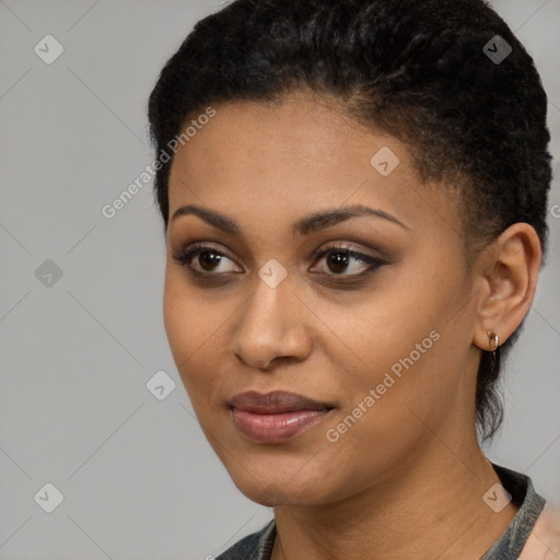 Joyful latino young-adult female with short  black hair and brown eyes