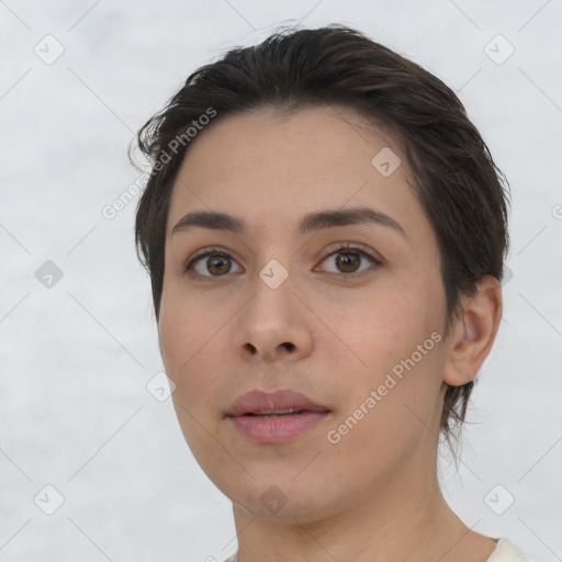 Neutral white young-adult female with short  brown hair and brown eyes