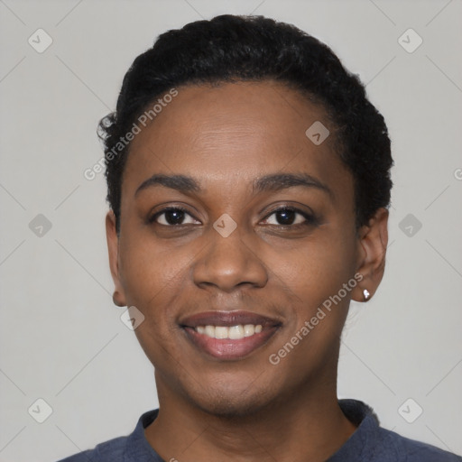 Joyful black young-adult female with short  black hair and brown eyes