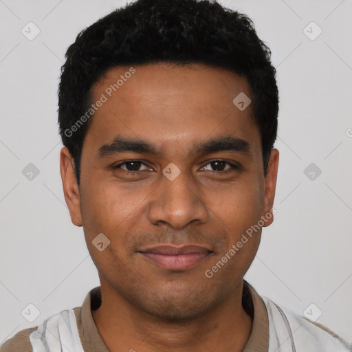 Joyful latino young-adult male with short  black hair and brown eyes