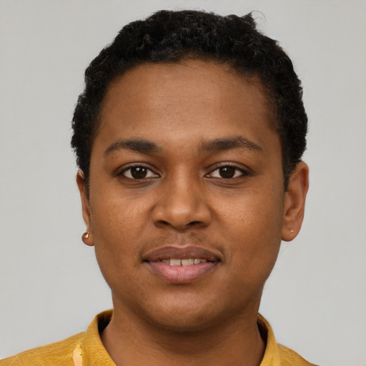 Joyful black young-adult male with short  brown hair and brown eyes
