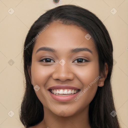 Joyful latino young-adult female with long  black hair and brown eyes