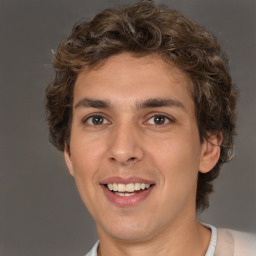 Joyful white young-adult male with medium  brown hair and brown eyes