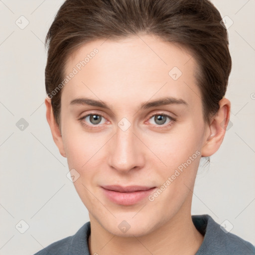 Joyful white young-adult female with short  brown hair and grey eyes