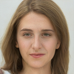 Joyful white young-adult female with long  brown hair and green eyes