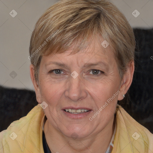 Joyful white adult female with medium  brown hair and blue eyes