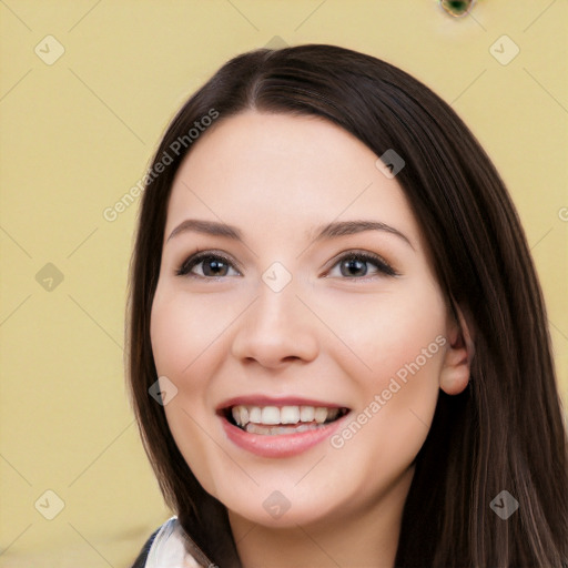 Joyful white young-adult female with long  black hair and brown eyes