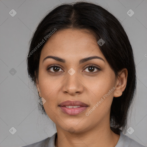 Joyful latino young-adult female with medium  brown hair and brown eyes