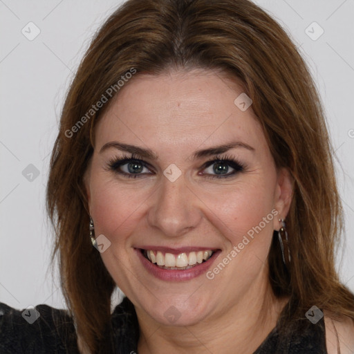 Joyful white adult female with long  brown hair and brown eyes