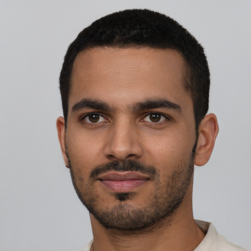 Neutral latino young-adult male with short  black hair and brown eyes