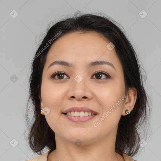 Joyful asian young-adult female with medium  brown hair and brown eyes